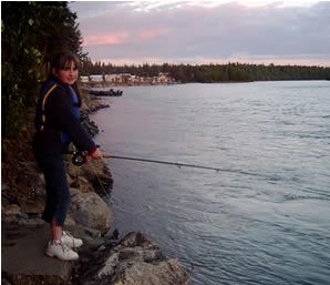 Allison fishing the world famous Kenai River for Rainbows