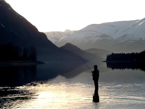 Morning silhouette on Kenai Lake at the headwaters of the Kenai River in Alaska